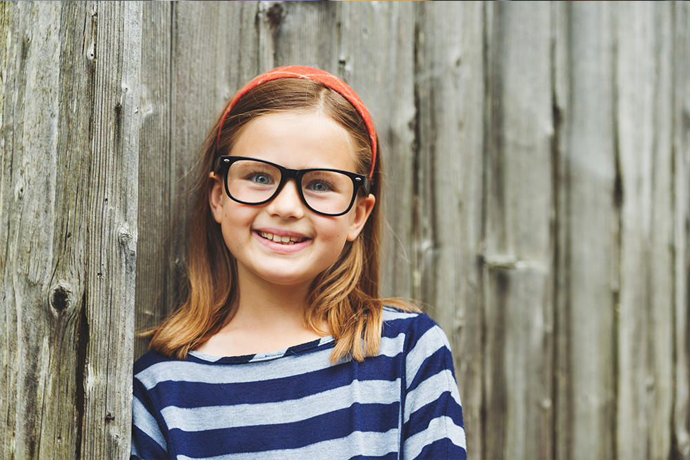 A child being fitted for vision correction at NVISION Eyecare